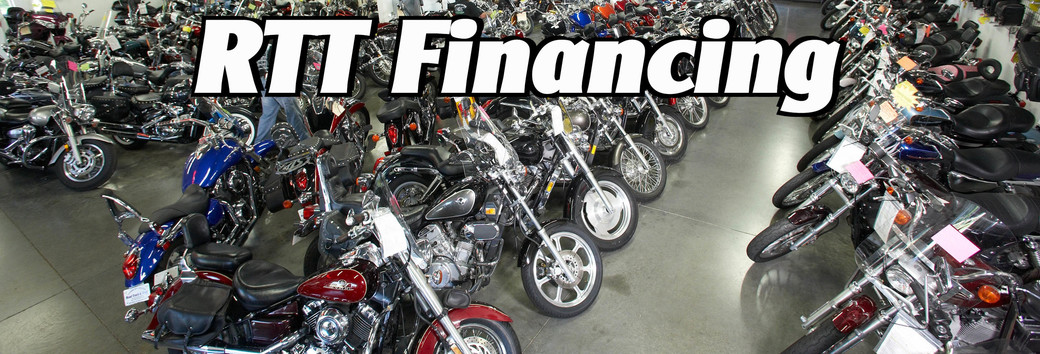 A showroom with a bunch on motorcycles lined up 